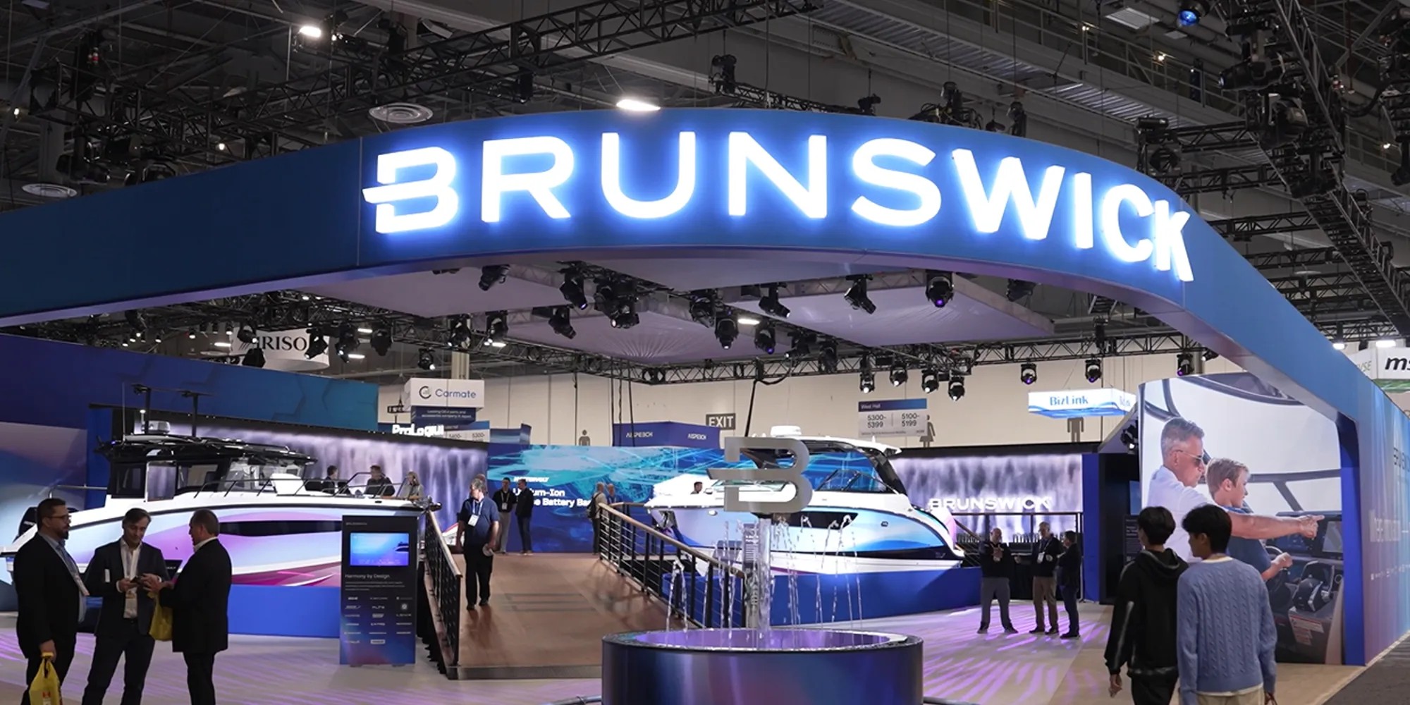 Brunswick booth at CES 2026 featuring a variety of boats and a display water feature.